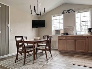 Dining - Cozy cabin retreat in rustic setting. Private lake, bonfire under the stars! (Lake)