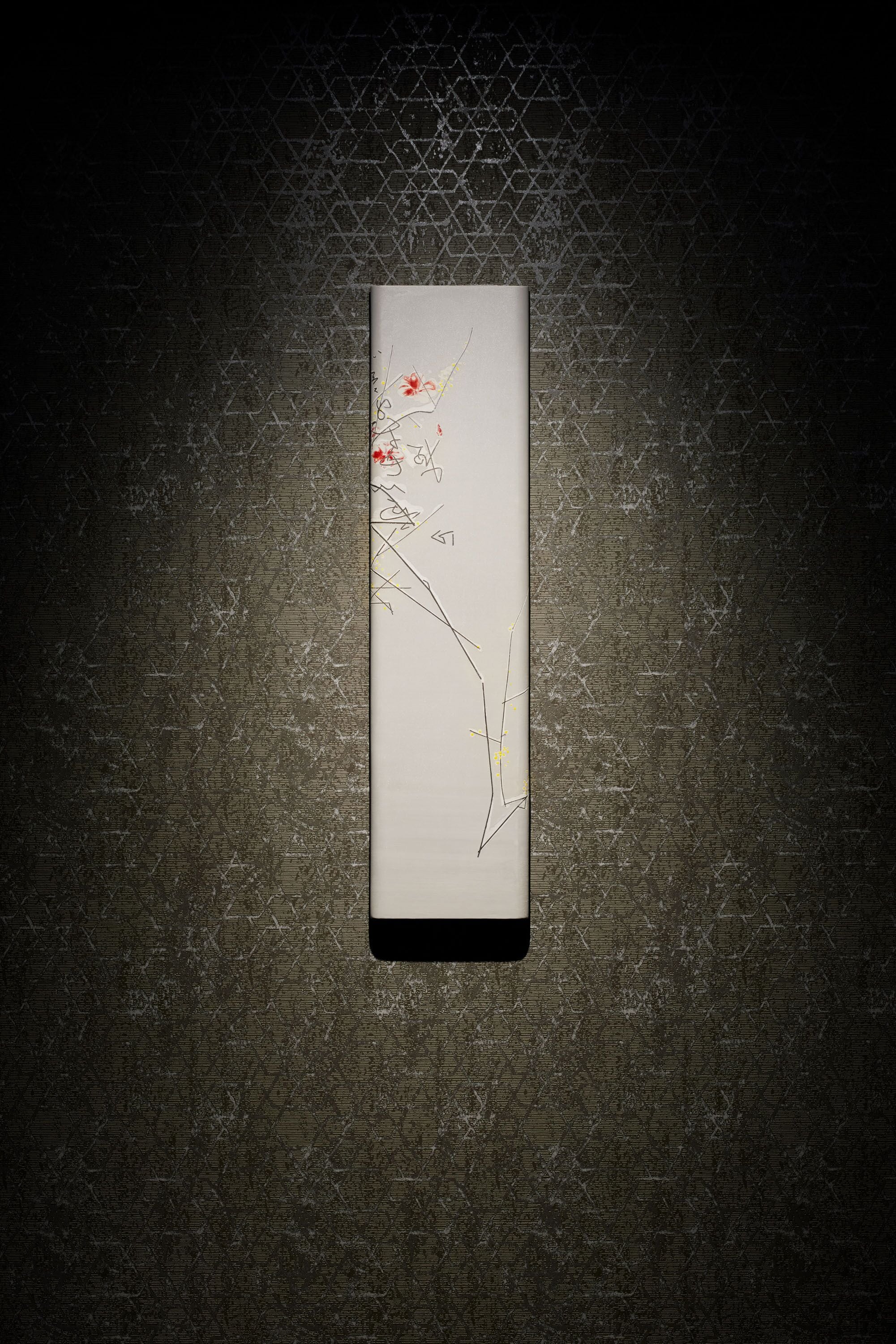 A rectangular object with a black bottom edge, placed on a textured surface with a hexagonal pattern.