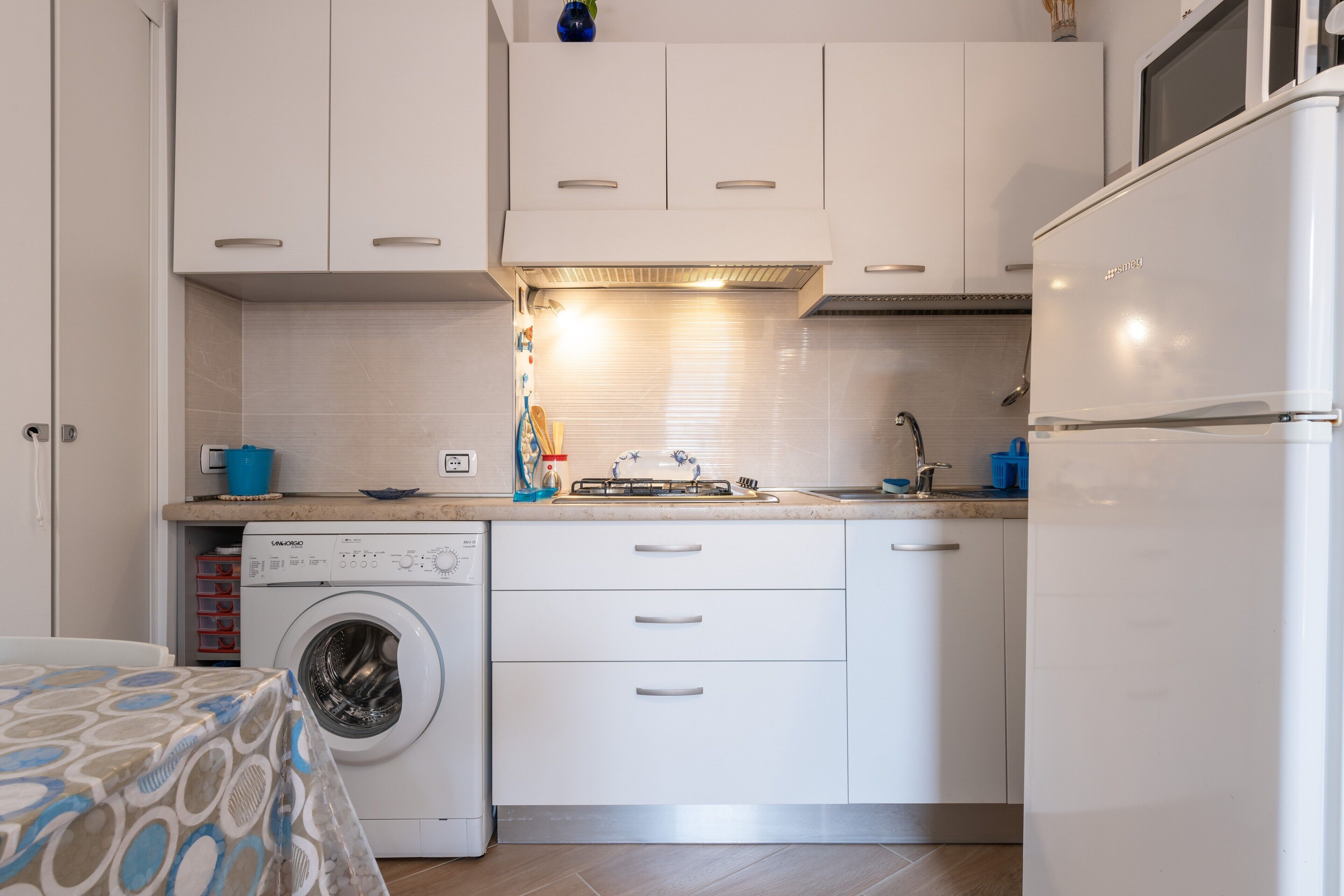 Fridge, microwave, stovetop, coffee/tea maker