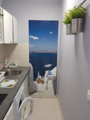 Fridge, stovetop, cookware/dishes/utensils, paper towels