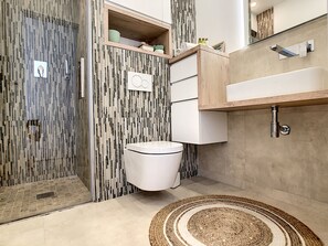 Shower, free toiletries, hair dryer, slippers