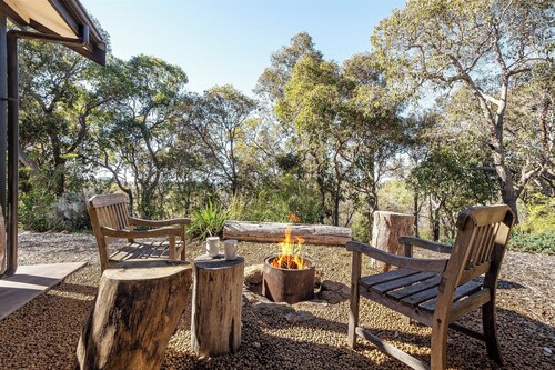 Nestled amongst the leafy trees, Gum Nuts a very Australian styled simple but sophisticated property
