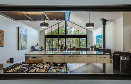 Nestled amongst the leafy trees, Gum Nuts a very Australian styled simple but sophisticated property