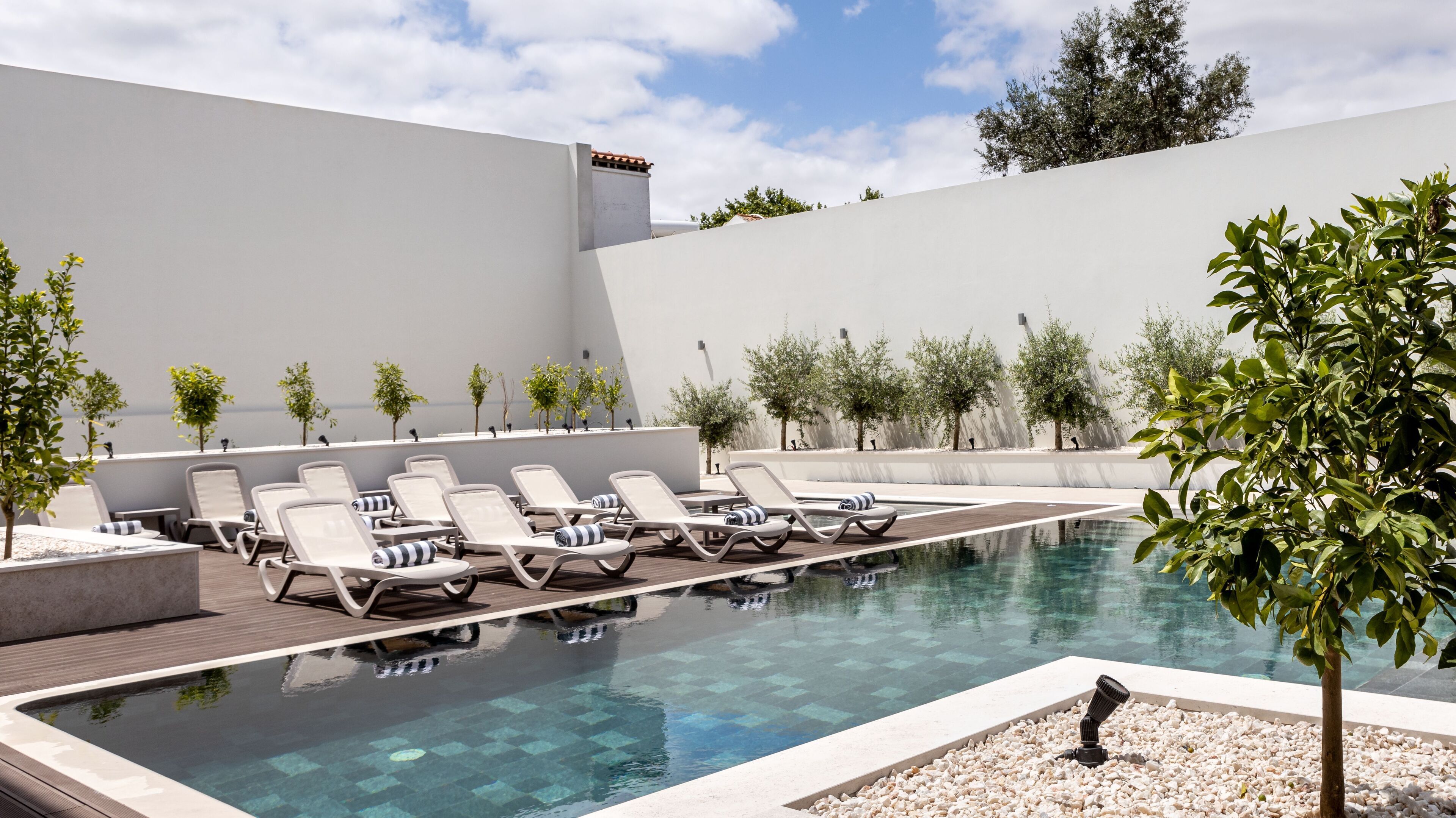 outdoor pool, open 8:00 am to 8:00 pm, pool umbrellas, pool loungers