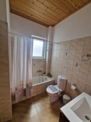 Bathtub, hair dryer, towels, soap