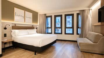 Habitación Deluxe | Escritorio, sistema de insonorización, wifi gratis y ropa de cama