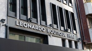 The exterior of the Leonardo Boutique Hotel with a modern facade, large windows, and a prominent hotel sign. - Leonardo Boutique Hotel San Sebastián (San Sebastián)