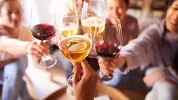 A group of people toasting with wine glasses.