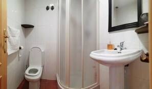 Shower, hair dryer, towels, toilet paper