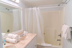 Combined shower/tub, hair dryer, towels, shampoo