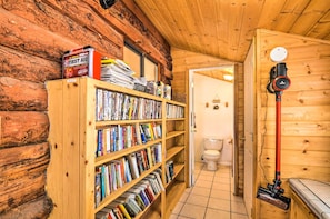 Cozy retreat with a bookshelf, first aid kit, and clean amenities.