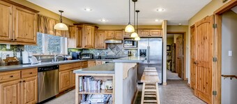 Ski-in/ski-out house with mountain view, gas fireplace, & wraparound deck