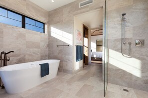 Bathtub, hair dryer, towels, soap
