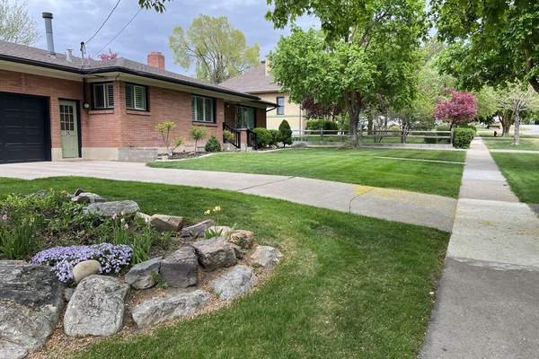 Facing East. Here is the driveway to park in and enter thru the green door.