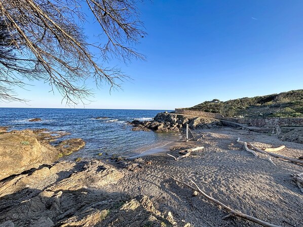 A rocky coastal landscape with clear skies.