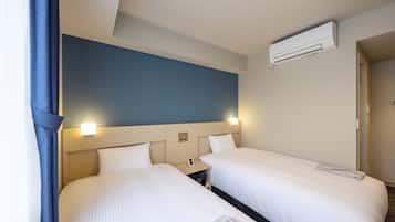 Chambre avec lits jumeaux, non-fumeurs | Coffres-forts dans les chambres, bureau, rideaux occultants