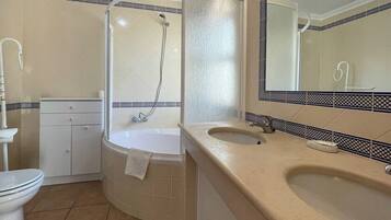 Bathtub, hair dryer, towels