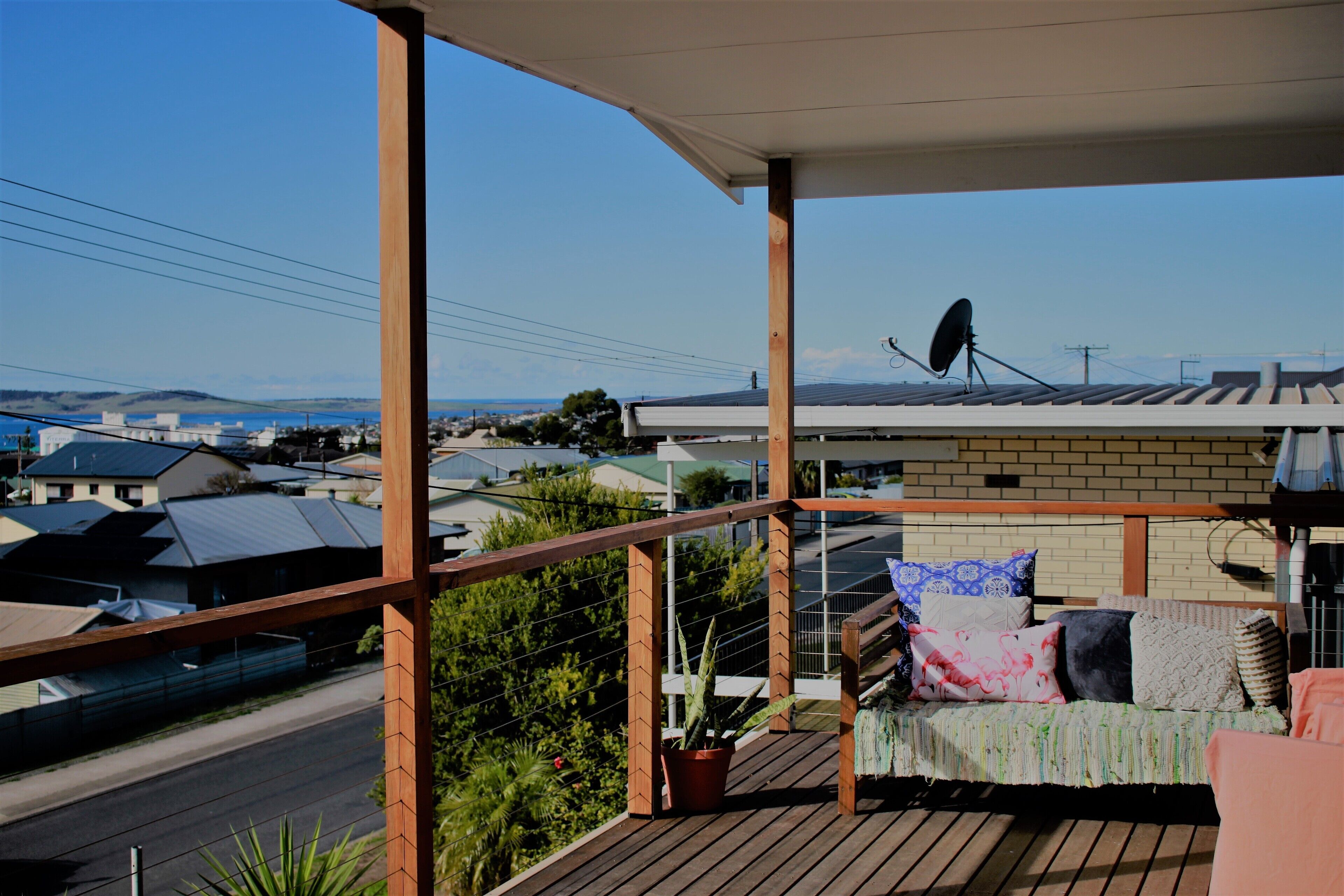 The front balcony has long ranging views over the city to Boston Bay.