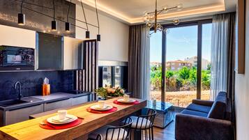 Fridge, microwave, stovetop, coffee/tea maker