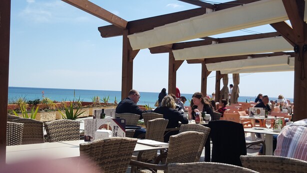 An outdoor dining area with wicker chairs and tables, overlooking the sea. - Very nice apartment in 1st line of golf (VC)