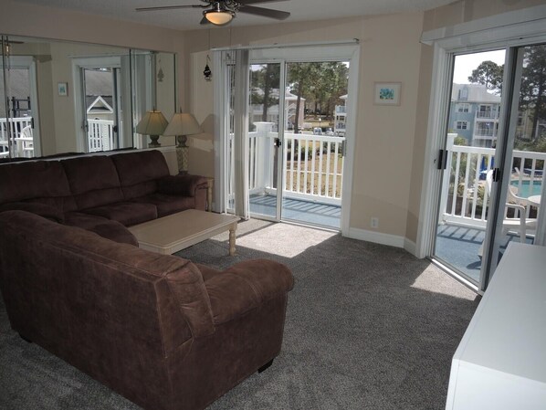 Villa, 2 Bedrooms | Living room - Pool View Unit 1509 at Brunswick Plantation feature 27 hole Golf Course Onsite by RedAwning (Calabash)