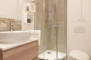Shower, hair dryer, towels, soap