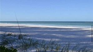 A beach with clear skies and calm waters. - LOCATION!! Cabana just steps from the beach! (Holmes Beach)