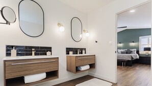 A modern bathroom with two sinks, wooden vanity, and a large mirror. - Shuffleboard/Swimming Pool/BBQ Grill, 4 Miles To The Strip, Pet Friendly! (Las Vegas)