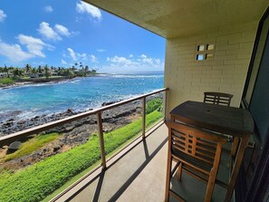 Outdoor dining - Ocean Front Condo with AC, enjoy the ocean from your own private lanai. (Koloa)