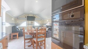 Coffee/tea maker, fridge, microwave, oven