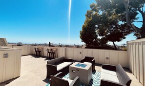 A rooftop patio with outdoor furniture and a view of the landscape. - Family friendly Grover Beach house located blocks from the ocean.    (Grover Beach)