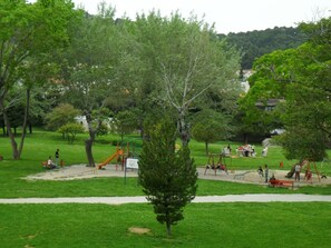 A park with playground equipment, benches, and trees. - Lovely studio apartment in the perfect location (Split)
