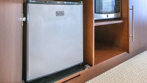 A kitchenette with a BLACK+DECKER refrigerator and a microwave. - The Library (Dublin)