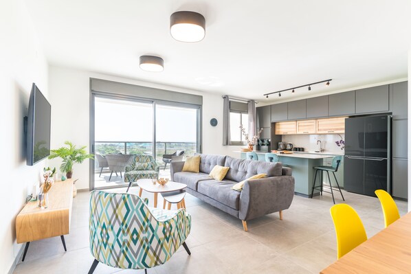 Apartment | Living area | TV - Sunlit Balcony & Coastal Charm by Sea N' Rent (Nahariya)
