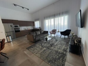 Apartamento | Zona de estar | Una televisión de pantalla plana