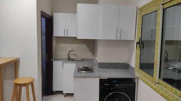 Fridge, stovetop, cookware/dishes/utensils, dining tables