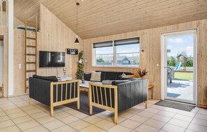 Téléviseur, foyer, lecteur de DVD, table de baby-foot