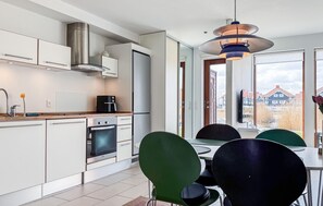 Fridge, stovetop, dishwasher, coffee/tea maker