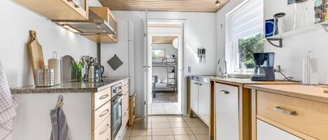 Fridge, stovetop, dishwasher, coffee/tea maker