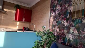 Comfort Apartment | Living area | 32-inch flat-screen TV with digital channels, TV