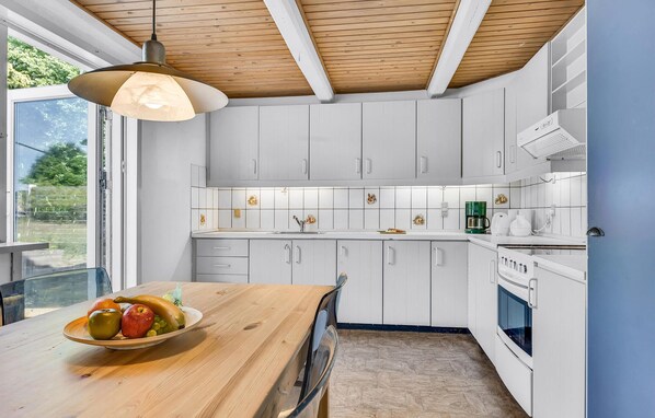 Fridge, stovetop, dishwasher, coffee/tea maker
