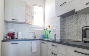Fridge, coffee/tea maker, cookware/dishes/utensils