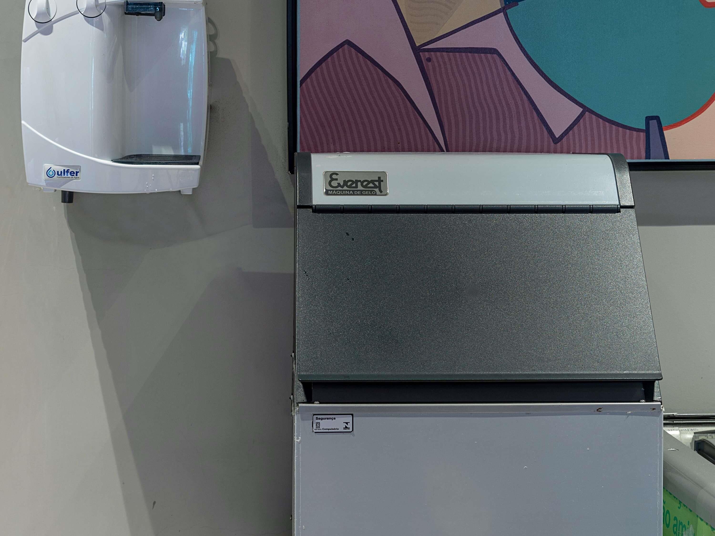 A piece of machinery with a label 'Cverrest' and a logo 'ulfer' on a wall.