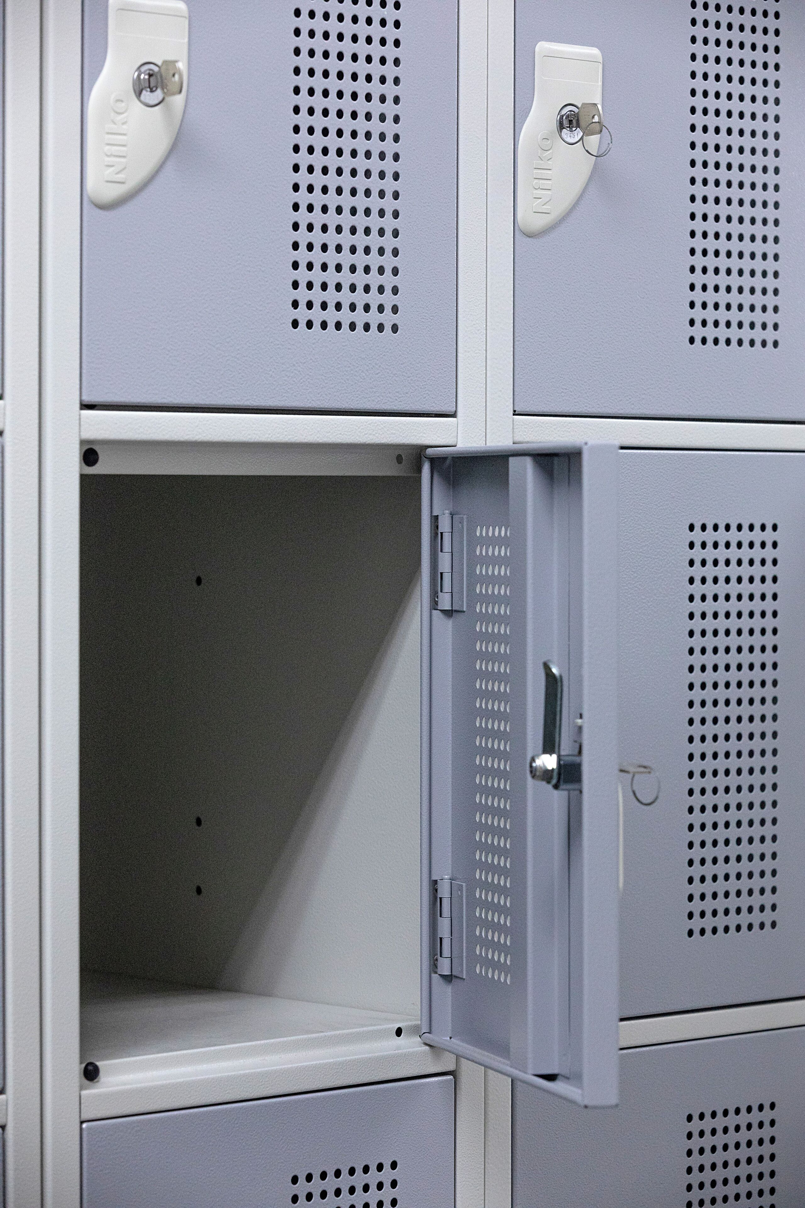 A row of metal lockers with a keyhole and a lock.
