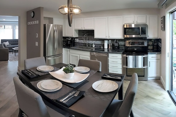 Modern Kitchen - Dining Combo with well stocked cabinets and sunny patio view.