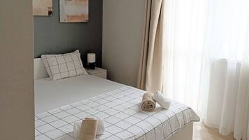Apartemen, 3 kamar tidur, balkon, pemandangan kota | 4 kamar tidur, setrika/meja setrika, dan seprai linen