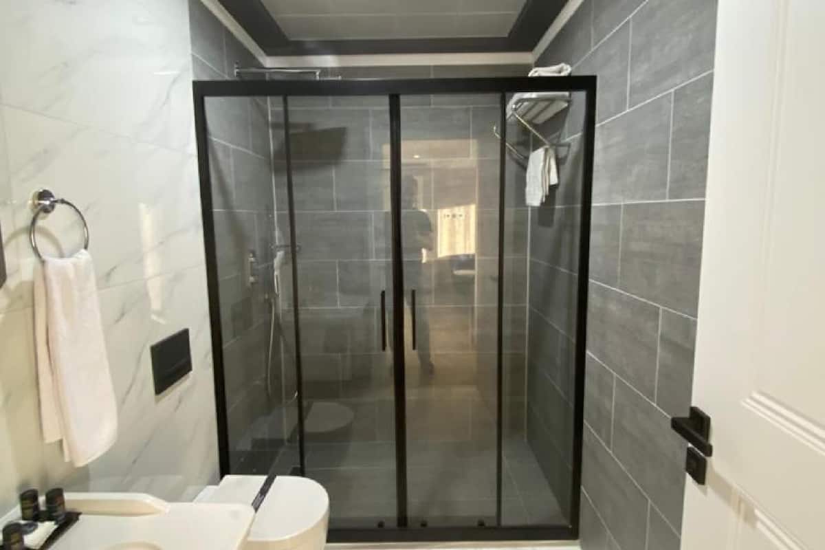 family room | bathroom | shower, free toiletries, hair dryer, slippers