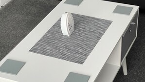 A white coffee table with a textured center, four square cutouts, and a small decorative object on top. - 2 Bedroom House  with the Caledonian Canal at rear. (Inverness)
