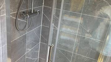 Shower, hair dryer, towels, toilet paper