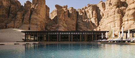 Outdoor pool, open 7:00 AM to 10:00 PM, pool umbrellas, sun loungers
